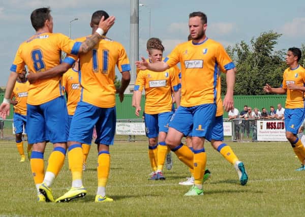 Rainworth Miners Welfare FC took on Mansfield Town at Rainworth , playing for the 'Green Energy trophy'. Stags celebrate the first goal