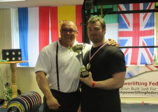 Anthony Spalding receives his best lifter award at Coventry.