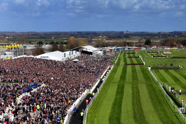 CROWD PLEASER -- huge crowds at Aintree's Grand National meeting in April helped to boost racing's attendance figures for the first half of the year (PHOTO BY: Peter Byrne/PA Wire).