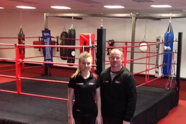 Kevin Henshaw with daughter, Amy, who is part of the coaching staff at the gym.