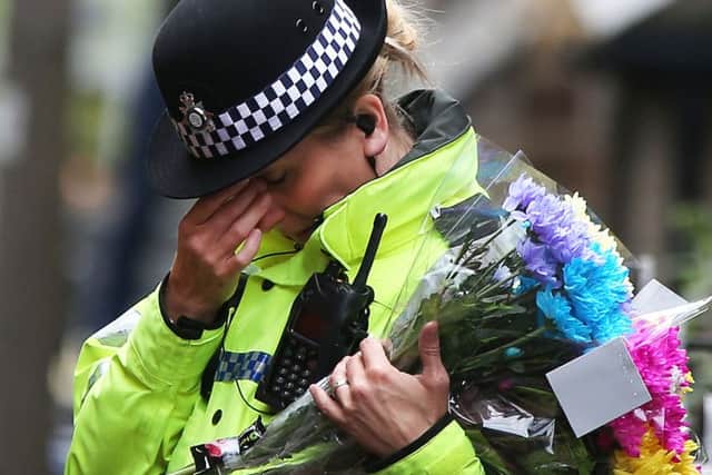 A police officer at a construction site on Bank End Road in Worsbrough, Barnsley, where the body of a child believed to be missing Conley Thompson has been found.