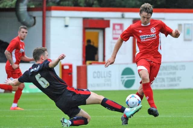 Alfreton v Rotherham.
Rotherham's Richie Smallwood challenges Sam Smith.