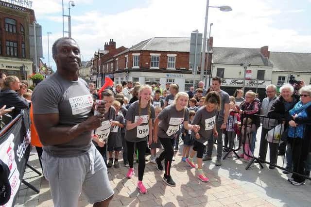 Linford Christie officiates at the 2015 Street Athletics event in Kirkby.