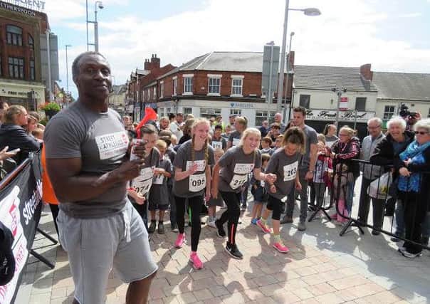 Linford Christie officiates at the 2015 Street Athletics event in Kirkby.