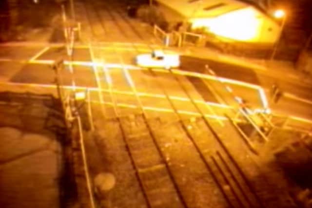 The Robin Reliant drove through the level crossing barriers and then reversed back through them again.