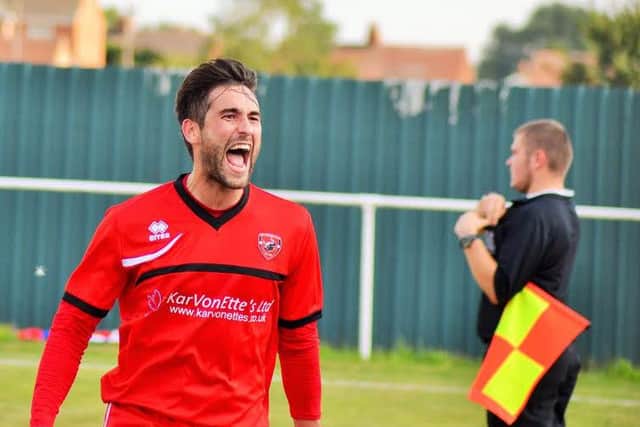 Phil Buxton celebrates his opening goal.