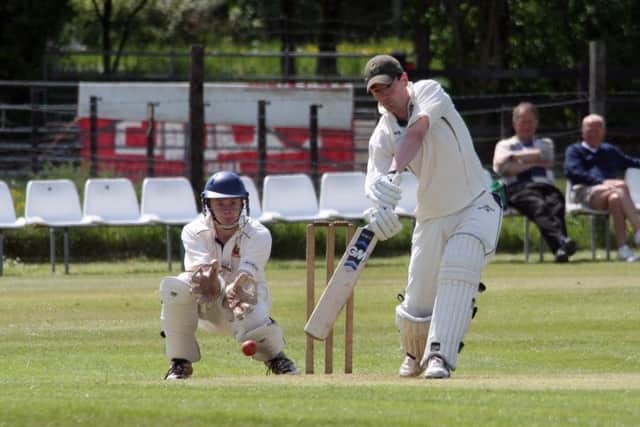 Robin Maxwell off drives Alex Cobbett.