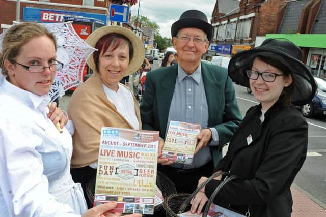 DH Lawrence Heritage volunteers, from left, Samantha Taylor, Linda Wilcockson, Brian Griffin and Amy Wilcockson hand out leaflets advertising up and coming events for the D.H. Lawrence Festival of Culture in Eastwood on Thursday.