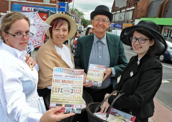 DH Lawrence Heritage volunteers, from left, Samantha Taylor, Linda Wilcockson, Brian Griffin and Amy Wilcockson hand out leaflets advertising up and coming events for the D.H. Lawrence Festival of Culture in Eastwood on Thursday.
