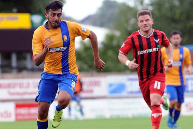 NMAC Mansfield Town v Oxford United
Malvind Benning gets away fgrom Alex McDonald