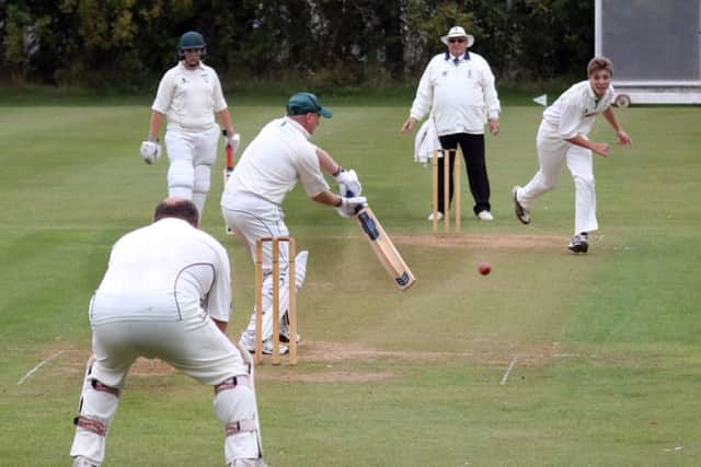Richard Garforth cover drives Josh Porter in the Glapwell v Cuckney game.