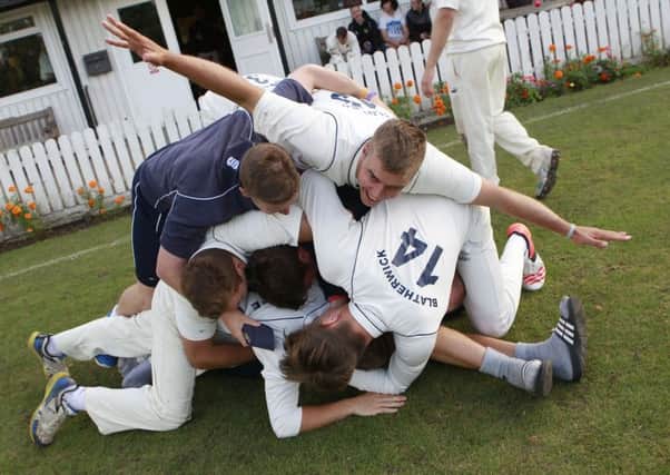 A ' pile on' ensues as Kimberley win the NPL title - Pic by: Richard Parkes