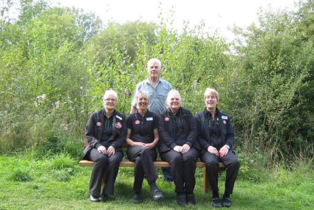 Members of the Stanton Hill Co-operative staff and Mr. Trevor Carter from Teversal Visitor Centre on the new bench at the Teversal trail