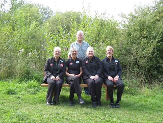 Members of the Stanton Hill Co-operative staff and Mr. Trevor Carter from Teversal Visitor Centre on the new bench at the Teversal trail