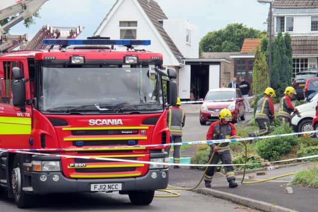 Fire crews at the house in Riddings, near Alfreton where two people died in a fierce house fire after a suspected gas blast. PRESS ASSOCIATION Photo. Picture date: Sunday September 20, 2015. See PA story FIRE Blast. Photo: Matthew Cooper/PA Wire