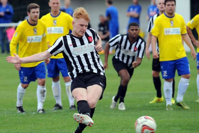 Alec Denton converts Clipstone's first half penalty to make it 2-1.