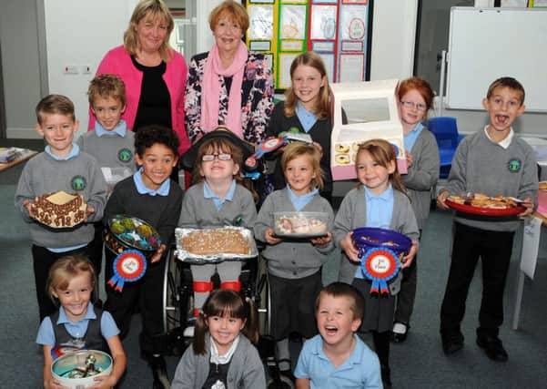 Pupils at Beardall Fields Primary School who achieved 'Star Baker' status in a bake-off organised by senior teaching assistant, Lisa Mather and judged by school volunteer, and Mary Berry for the day, Christine Sinclair.