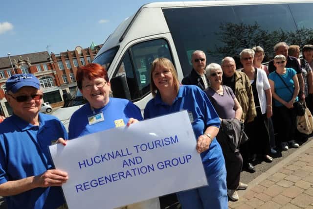 free bus tour for Hucknall Tourism and Regeneration Group (HTRG). Pictured front l-r is Pat Richards tour guide, Sheila Robinson organiser and Kathy Williams escort.