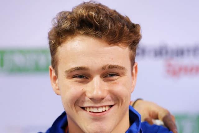 EINDHOVEN, NETHERLANDS - AUGUST 06: Oliver Hynd of Great Britain smiles with his goal medal after he wins the Mens 200m Medley SM8 final during the IPC Swimming European Championships held at the Pieter van den Hoogenband Swimming Stadium on August 6, 2014 in Eindhoven, Netherlands. (Photo by Dean Mouhtaropoulos/Getty Images)