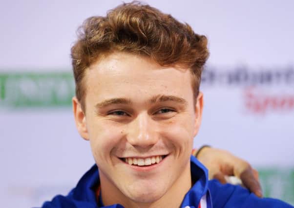 EINDHOVEN, NETHERLANDS - AUGUST 06:  Oliver Hynd of Great Britain smiles with his goal medal after he wins the Mens 200m Medley SM8 final during the IPC Swimming European Championships held at the Pieter van den Hoogenband Swimming Stadium on August 6, 2014 in Eindhoven, Netherlands.  (Photo by Dean Mouhtaropoulos/Getty Images)