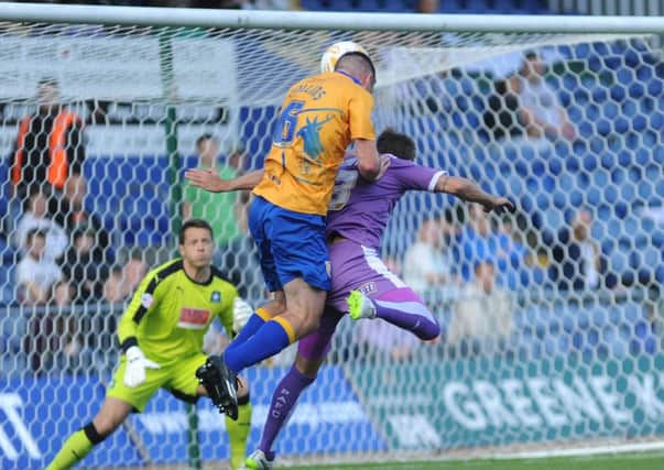 Mansfield Town v Plymouth -Skybet League One - One Call Stadium - Saturday 26th September 2015

Lee Collins wins an aerial battle