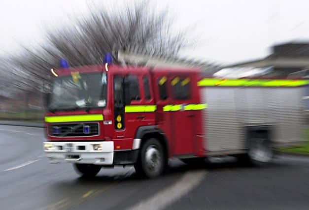 A fire engine leaves Wakefield Fire Station.16th December 2002...
