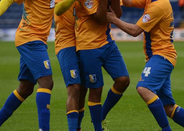 Mansfield Town v Newport County - Skybet League Two - One Call Stadium - Saturday 10th October 2015

Malvind Benning gets mobbed after his wonder strike for goal 2