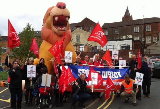 Unite union and Derbyshire Unemployed Workers Centre campaigners rallied for Sports Direct staff outside Chesterfield magistrates' court where the company's chief executive faces a court charge.