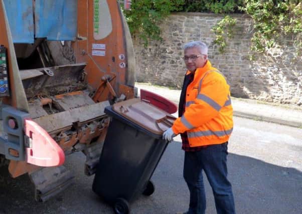 Councillor Tim Brown helping Ashfield's binmen on their waste collection round.