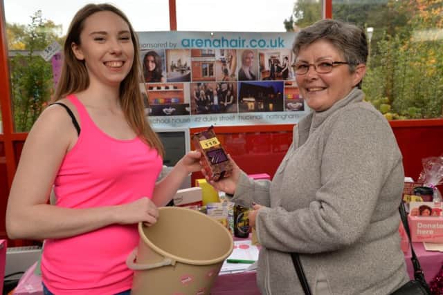 Breast cancer fundraising event at Hucknall Leisure Centre, Mary-Clare Endy recieves her tombola prize from Angela Benski