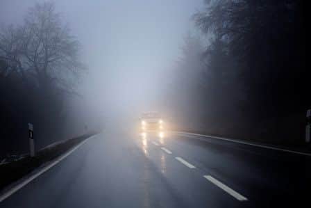 Fog on the country road, oncoming traffic - bad weather conditions, shot during driving - cam was fixed on a tripod. Some minor bluring