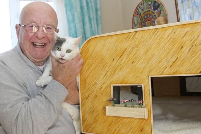Mike Nunns with his cat house made from 25,000 matches