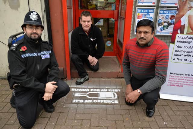 Ashfield District Council initative to stop people buying alcohol for under 18's, pictured is PC Martin Severn, Local Choice shop owner Shinto Mathew and Ashfield Council Lead Development Officer Steve Hughes