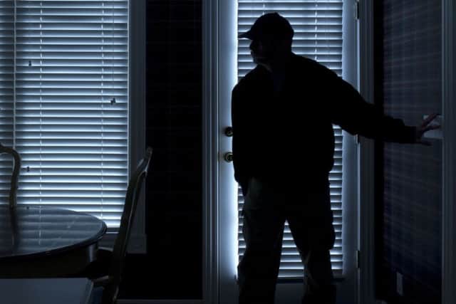 A home break in. Posed by a model.