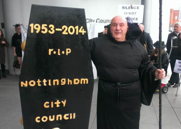Mickey Summers protests outside Nottingham City Council.