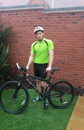 Jason Hanson, 35, from Forest Town, will cycle alone from Mansfield to Bakewell on Saturday as part of a fundraiser to help 10-month-old boxer dog, Roxy.