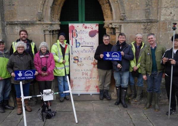 The Battle of Hatfield Society with their banner outside Cuckney St Mary's Church.