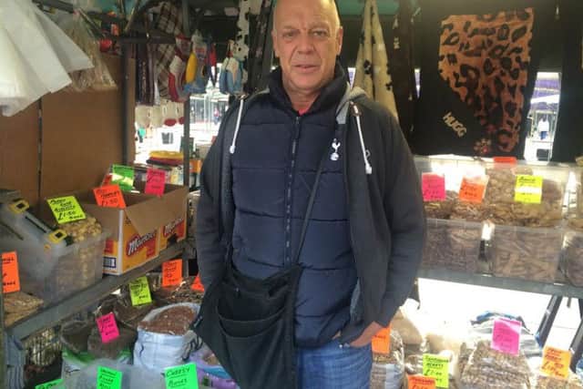 Steve Louth works on a pet stall in Mansfield market place