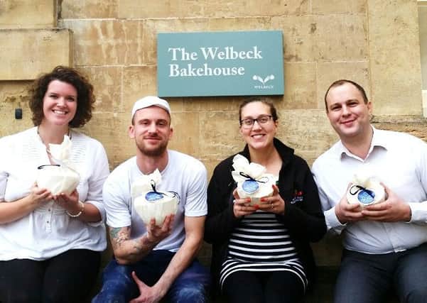 Emma Hall, bakery manager, Rob Taylor, head baker, Claire Monk, head brewer, Oliver Stubbins, farm shop manager, with the Welbeck luxury Christmas puddings.