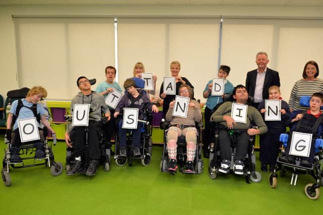 Staff and students at Fountaindale School celebrate their Outstanding Ofsted inspection, pictured with the students are Principal RCCO Paula Henderson, specialist teaching assistant independent living Rosie Harrison, specialist teaching assistant communication Jo Hook and Principal Mark Dengel