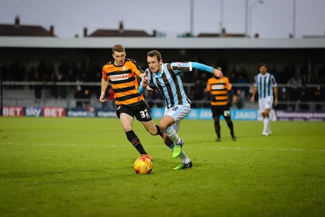 Mansfield Town's Blair Adams breaks past the Barnet defence