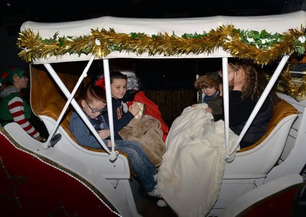 Santa paid a surprise visit to Toby and Grace McCran aged eight and three in a horse drawn sleigh
