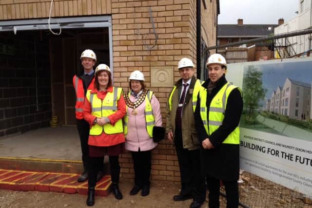 On site at Darlison Court. From left: Senior Build Manager at Willmott Dixon, David McDonald;  At the topping out ceremony at Darlison Court: Leader of Ashfield District Council, Cllr. Cheryl Butler; Chairman of Ashfield District Council, Cllr. Glenys Maxwell;  Vice chair of Nottinghamshire County Councils Adult social care and health committee, Cllr. Alan Bell; and Ashfield District Council Portfolio holder for Housing and Asset management, Cllr. Keir Morrison