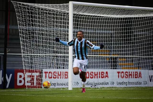Reggie Lambe celebrates the winning goal for Mansfield Town at Barnet on Saturday,