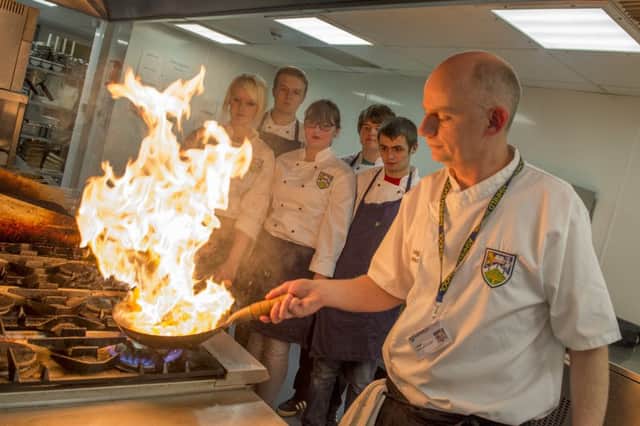 Students at Ashfield School have been preparing  a Christmas Carvery. Craig Harrison demonstrates how to flambe