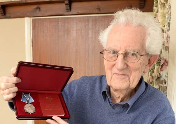 War veteran Don Reynolds at his home in Kimberley with his latest medal he received from Russia