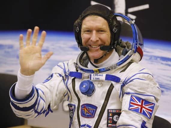 British astronaut Tim Peake, member of the main crew of the expedition to the International Space Station (ISS), gestures prior the launch of Soyuz TMA-19M space ship at the Russian leased Baikonur cosmodrome, Kazakhstan, Tuesday, Dec. 15, 2015. Peake, the first Briton to represent the European Space Agency aboard the International Space Station, will be away from the planet for six months but looks forward to Earthly pleasures like seeing the new Star Wars movie and having a Christmas pudding. (AP Photo/Dmitry Lovetsky)