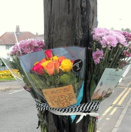 Flowers at the scene of the accident on Kirkby Road, Sutton.