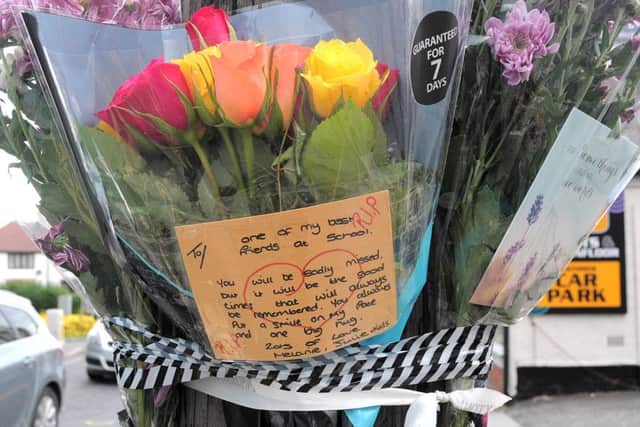 Flowers at the scene of the crash.