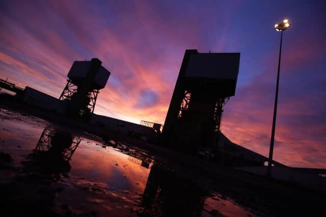 The sun rises over Kellingley colliery in Yorkshire as miners finish the last shift at the last deep coal mine in the UK.  Photo - Ross Parry/SWNW Group.